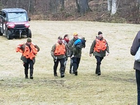 Jude Walter Leyton, 3, is returned to his family on April 1 after he spent three and a half days alone in the woods of South Frontenac Township south of Fermoy.