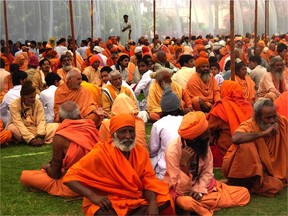 Holy men gather during the spring Hindu Holi Festival, also known as the festival of love and the festival of colours, in Rishikesh, a village north of Delhi, India. Holi celebrates the arrival of spring and the triumph of good over evil.