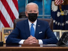 U.S. President Joe Biden speaks from the Resolute Desk prior to signing executive orders related to immigration in the Oval Office of the White House in Washington, D.C., on Feb. 2.