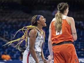 Kingston's Aaliyah Edwards of the University of Connecticut Huskies in action against Emily Engster of the Syracuse Orange during the second round of the NCAA women's basketball tournament on March 23 at the Alamodome in San Antonio, Texas.
