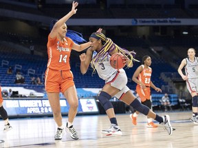 Kingston's Aaliyah Edwards of the University of Connecticut Huskies in action against Kamilla Cardoso of the Syracuse Orange during the second round of the NCAA women's basketball tournament on Tuesday, March 23, at the Alamodome in San Antonio, Texas.