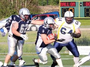 Sault Steelers defensive tackle Brandon Lewis (right) tries to chase down Sudbury running back Matt Glass in 2019 Northern Football Conference action at James Jerome Sports Complex in Sudbury.
PHOTO BY BEN LEESON/POSTMEDIA NETWORK