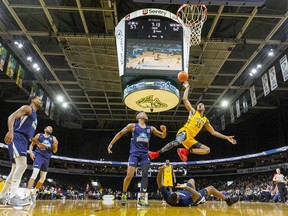 AJ Gaines of the London Lightning tries for a shot after colliding with Carl Hall of the Halifax Hurricanes during a game at Budweiser Gardens in London. Photograph taken on Sunday February 9, 2020. (Mike Hensen/The London Free Press)