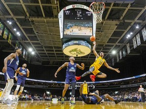 AJ Gaines of the London Lightning tries for a shot after colliding with Carl Hall of the Halifax Hurricanes during a game at Budweiser Gardens in London. Photograph taken on Sunday February 9, 2020. Mike Hensen/The London Free Press/Postmedia Network
