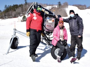 Photo by KEVIN McSHEFFREY/THE STANDARD
Paul Eldon - a member of the Mount Dufour Ski Area board, Pam Sarich - a long-time member and patron, and Dave Brunet - Mount Dufour operations director, stand in front of the newest snow gun at the ski area. It was purchased with a donation from Elliot Lake Retirement Living.