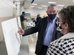 West Perth Mayor Walter McKenzie (left) answers some questions from Mitchell resident Michelle Chessell during a municipal open house March 30 at the West Perth Community Centre about the new planned administration building. Approximately 35 people attended the two open houses as well as another dozen or so who participated electronically March 31. ANDY BADER/MITCHELL ADVOCATE