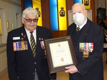 Royal Canadian Legion Branch 72 recently honoured Korean War veteran John Henshaw (right) with a life membership. Presenting the plaque marking the occasion was Honours and Awards Chairman Bob Handspiker. Anthony Dixon