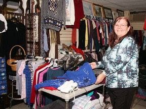 Blanche Mirault, owner/operator of Pembroke's Got You in Mind community-oriented thrift store, is always busy adjusting the merchandise at the Hincks Street location. A GoFundMe campaign has been started to raise rent for a year to help keep the store open.