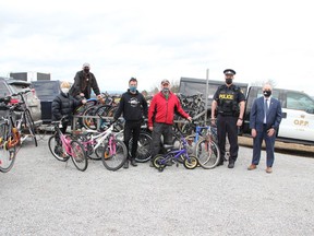 Ottawa Valley Cycling and Active Transportation Alliance (OVCATA) has received a donation of bikes from the Pembroke Police Services Board and Upper Ottawa Valley detachment of the Ontario Provincial Police. The bikes will be fixed up and passed on to people in need. On hand for the presentation (from left) OVCATA co-chairwoman Patricia Krose, OVCATA director Bob Peltzer, Yantha Cycle owner Adam Yantha, OVCATA co-chairman Ron Moss, UOV OPP media relations officer Const. Shawn Peever and Pembroke Police Services Board chairman Ron Gervais.