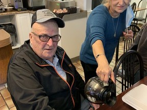 Effie Koutoupi pouring a coffee for one of her regulars, Wes Dixon, a few days before her retirement in October 2020. Photo courtesy of Aileen Cnockaert