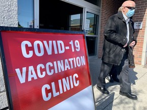 Tom White walks out of the COVID-19 vaccination clinic Tuesday at the Stratford Rotary Complex in this Beacon Herald file photo from March 9, 2021. (Beacon Herald file photo)