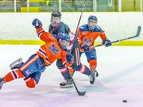 Tyson Doucette (right) of the Soo Thunderbirds chases the loose puck as a teammate and a Blind River Beavers opponent collide during recent Northern Ontario Jr. Hockey League action at John Rhodes Community Centre. The Thunderbirds and Beavers faced off 17 times as cohort opponents this season. BOB DAVIES/SAULT THIS WEEK