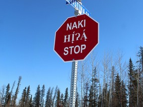 A stop sign in Anzac in Cree (top), Dene and English. Supplied Image/Regional Municipality of Wood Buffalo