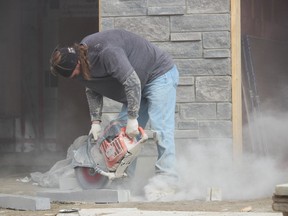 Leon MacLeod, with Custom Stone, is shown working on construction of a new house at Ferdinands Crescent in Sarnia. February was another strong month for real estate sales in the Sarnia area, according to the Sarnia-Lambton Real Estate Board.