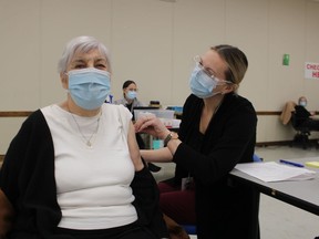 Helen Marcy, 94, of Sarnia gets vaccinated at the Point Edward Arena earlier this month. Monday, COVID-19 vaccination eligibility expanded to include those 80 and older in Lambton.
(Paul Morden/The Observer)
