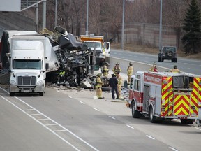 Emergency vehicles and crews are shown near two transport trucks that came into collision Tuesday on Highway 402 near Christina Street in Sarnia. Drivers of both trucks were taken to hospital and a section of the westbound highway was closed.