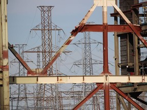 This file photo shows a view of electricity towers behind the former Lambton Generating Station through a section of the Courtright-area facility that is being demolished.