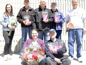 Dave LeClair, middle, is pictured in 2019 with others offloading boxes of flowers in preparation for the MS Society of Canada's annual Carnation Campaign. LeClair was recently honoured with a volunteer fundraising award from the MS Society. (File photo)