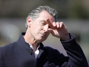 California Gov. Gavin Newsom pauses during a news conference after touring Barron Park Elementary School on March 02, 2021 in Palo Alto, California. California Gov. Gavin Newsom visited a reopened elementary school a day after he announced a $6.6 billion school reopening agreement with the State legislature.