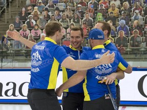 Brendan Bottcher (centre) celebrates with his team at Canada Olympic Park in Calgary after winning his first Tim Hortons Brier title on Sunday, Mar. 14. Photo by Michael Burns/Curling Canada.