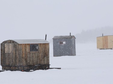 Fishing huts sit on the ice surface of Ramsey Lake in Sudbury, Ont. on Tuesday March 2, 2021. John Lappa/Sudbury Star/Postmedia Network
