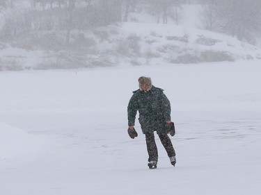 A lone skater braves the wintery weather while skating on the Ramsey Lake skating path in Sudbury, Ont. on Tuesday March 2, 2021. John Lappa/Sudbury Star/Postmedia Network