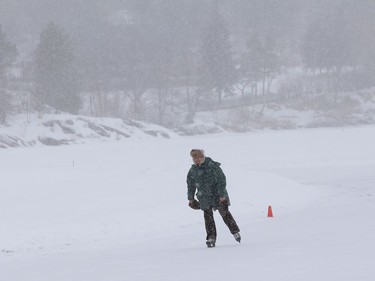 A lone skater braves the wintery weather while skating on the Ramsey Lake skating path in Sudbury, Ont. on Tuesday March 2, 2021. John Lappa/Sudbury Star/Postmedia Network