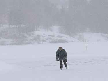 A lone skater braves the wintery weather while skating on the Ramsey Lake skating path in Sudbury, Ont. on Tuesday March 2, 2021. John Lappa/Sudbury Star/Postmedia Network