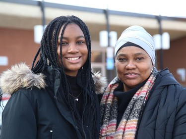 Aicha Barry, 17, and her mom, Salma Barry, stand outside Ecole secondaire Macdonald-Cartier where Aicha attends high school in Sudbury, Ont. The teenager won a Horatio Alger scholarship. John Lappa/Sudbury Star/Postmedia Network