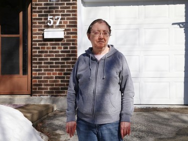 Lesley Bramah stands outside her condo unit in Sudbury, Ont. on Tuesday March 9, 2021. John Lappa/Sudbury Star/Postmedia Network