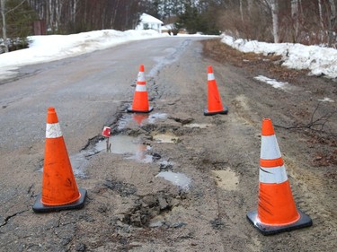 A sure sign of spring is when area roads like Phil Street in Naughton, Ont., show winter wear and tear. John Lappa/Sudbury Star/Postmedia Network