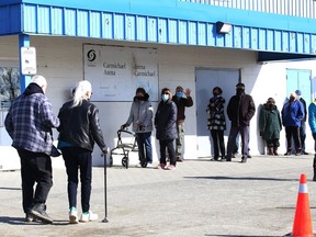 People attend a vaccination clinic at Carmichael Arena in Sudbury, Ont. For more information or if you have questions, visit phsd.ca/COVID-19 or call Public Health Sudbury an Districts at 705-522-9200 (toll-free 1-866-522-9200). Public Health returns all calls received; however, at times, inquiry volumes are high. Patience is appreciated. John Lappa/Sudbury Star/Postmedia Network