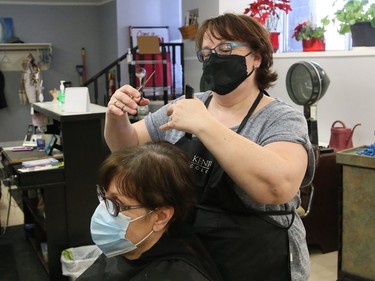 Claire Pilon, of His and Hers Hairstylists on Durham Street, trims Barbara Galecka's hair on March 11. Hairstylists, barbers and gyms will have to temporarily close their businesses as Greater Sudbury moves into the grey/lockdown level Friday in response to a COVID-19 surge.