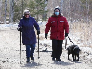 Barbara Rasinaho and Sue Kari take Angel for a walk at Fielding Memorial Park in Greater Sudbury, Ont. on Friday March 12, 2021.
