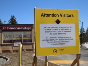 Signs are posted at various locations at Cambrian College in Sudbury, Ont. advising the public to follow provincial and municipal COVID-19 measures. John Lappa/Sudbury Star/Postmedia Network