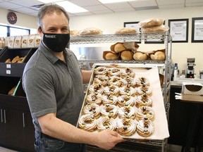 Max Massimiliano, of Regency Bakery in Sudbury, Ont., displays zeppole at the store on Tuesday March 16, 2021. Regency Bakery has partnered with Doyle Dodge and will donate one dollar from every zeppole that is sold between March 13 to March 20, 2021, to St. Joseph's Foundation of Sudbury, in honour of the Feast of St. Joseph that is celebrated on March 19. John Lappa/Sudbury Star/Postmedia Network