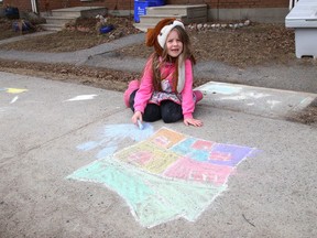 Zoey Johnston, 6, let her creativity flow as she chalked masterpieces on a sidewalk in Sudbury, Ont. on Tuesday March 23, 2021. John Lappa/Sudbury Star/Postmedia Network