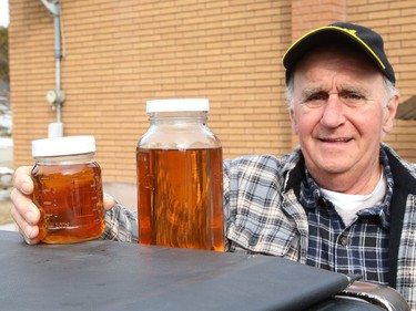Daniel Boisvert, of Naughton, Ont., shows maple syrup he made recently. John Lappa/Sudbury Star/Postmedia Network