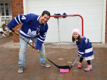 Mike Commito plays some street hockey with his daughter, Zoe, 4, at their home in Sudbury, Ont. on Wednesday March 24, 2021. John Lappa/Sudbury Star/Postmedia Network