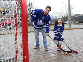 Mike Commito plays some street hockey with his daughter, Zoe, 4, at their home in Sudbury, Ont. on Wednesday March 24, 2021. John Lappa/Sudbury Star/Postmedia Network