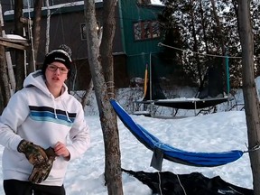 Sgt. Mongeon of 2912 RCACC in Sudbury demonstrates how to use a hammock as a winter shelter during the improvised shelters portion of the exercise. Capt. F. Guay, Cadets Canada