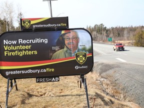 A billboard advertising for volunteer firefighters, sits on the location of  the Beaver Lake Welcome Centre on Tuesday March 30, 2021. John Lappa/Sudbury Star/Postmedia Network