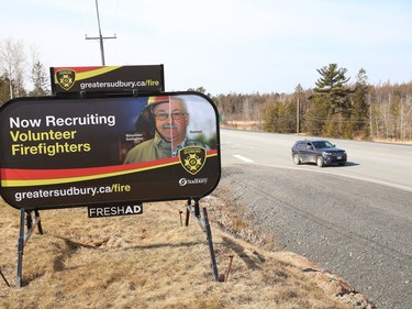 A billboard advertising for volunteer firefighters, sits on the location of  the Beaver Lake Welcome Centre on Tuesday March 30, 2021. John Lappa/Sudbury Star/Postmedia Network