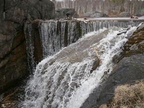 A small waterfall releases water overflow from Lake Laurentian in Sudbury, Ont. on Wednesday March 31, 2021. John Lappa/Sudbury Star/Postmedia Network