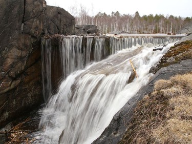 A small waterfall releases water overflow from Lake Laurentian in Sudbury, Ont. on Wednesday March 31, 2021. John Lappa/Sudbury Star/Postmedia Network