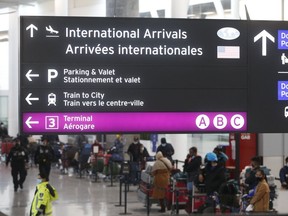 The COVID positive flight arrival lineup at Pearson International Airport located in Terminal One. New guidelines have been introduced for passengers arriving back in Canada from abroad with a three-day quarantine at various selected hotels near the airport Monday February 22, 2021.