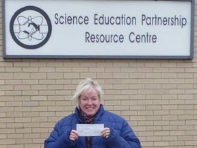 The Science Education Partnership's Wendy Hooghiem received a cheque for $1,000 from the Golden K Kiwanis Club of Sarnia-Lambton on March 2.  Handout/Sarnia This Week