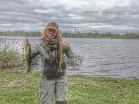 Amanda Lynn Mayhew holds up her catch after a day of fishing and filming at Grassy Lake, north of Cochrane, in June 2020. Mayhew was in the area to shoot episodes for the upcoming season of That Hunting Girl which begins airing March 29.

Supplied