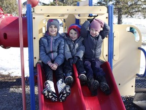 Alissia Fontaine, on right, with her brother Noah and step-sister, Skyla Turcotte, were enjoying the mild weather at Hollinger Park on Tuesday. Sunny days with daytime temperatures well above zero are expected to continue right through the weekend.

RICHA BHOSALE/The Daily Press