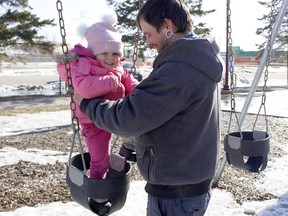 Blake Kittmer decided to take advantage of the sunshine and mild temperatures Timmins has been enjoying the last few days, taking his daughter Nyxon, 2, for a swing at Hollinger Park on Friday afternoon. The sunny, spring-like conditions are expected to continue throughout the weekend.

RICHA BHOSALE/The Daily Press